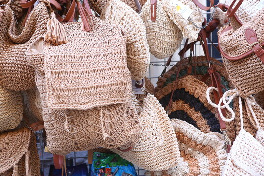 wickered bag assortment on the Spanish outdoor shop closeup photo