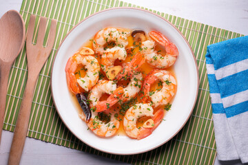 Gambas al ajillo. Shrimp Scampi. Traditional tapa recipe from the south of Spain cooked with seafood and sautéed garlic.