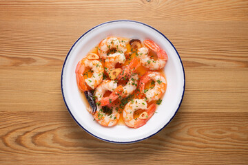 Gambas al ajillo. Shrimp Scampi. Traditional tapa recipe from the south of Spain cooked with seafood and sautéed garlic.