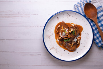 Fricando veal. Traditional Barcelona tapas cooked with a very fine fillet of high-quality beef and mushroom sauce.