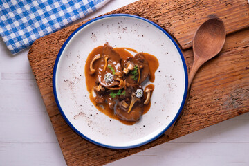 Fricando veal. Traditional Barcelona tapas cooked with a very fine fillet of high-quality beef and mushroom sauce.