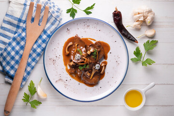 Fricando veal. Traditional Barcelona tapas cooked with a very fine fillet of high-quality beef and mushroom sauce.