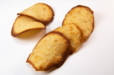 French delicacy pastry tuile with almond on wight background, High quality photo