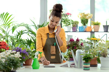 Florist taking orders over the phone