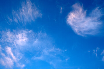 Fototapeta na wymiar White clouds against a blue sky.