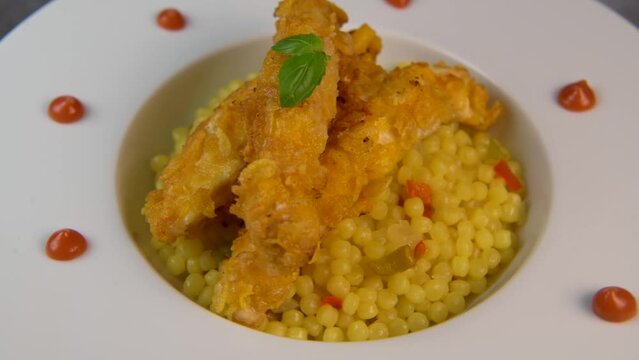 Recipe for chicken tenders with corn flakes and Italian Piombo pasta risotto and peppers. High quality video
