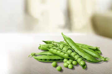 Perfect tasty green peas in pod on the desk