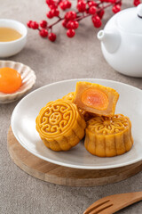 Delicious Cantonese moon cake for Mid-Autumn Festival food mooncake on gray table background.
