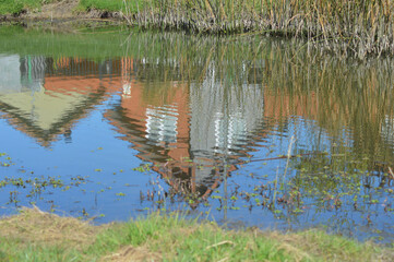 reflection of some houses in a river in southern Chile
