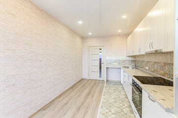 Russia, Moscow- May 21, 2020: interior apartment kitchen and dining room, refectory area cooking equipment, table furniture stove