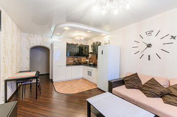 Russia, Moscow- May 21, 2020: interior apartment kitchen and dining room, refectory area cooking equipment, table furniture stove