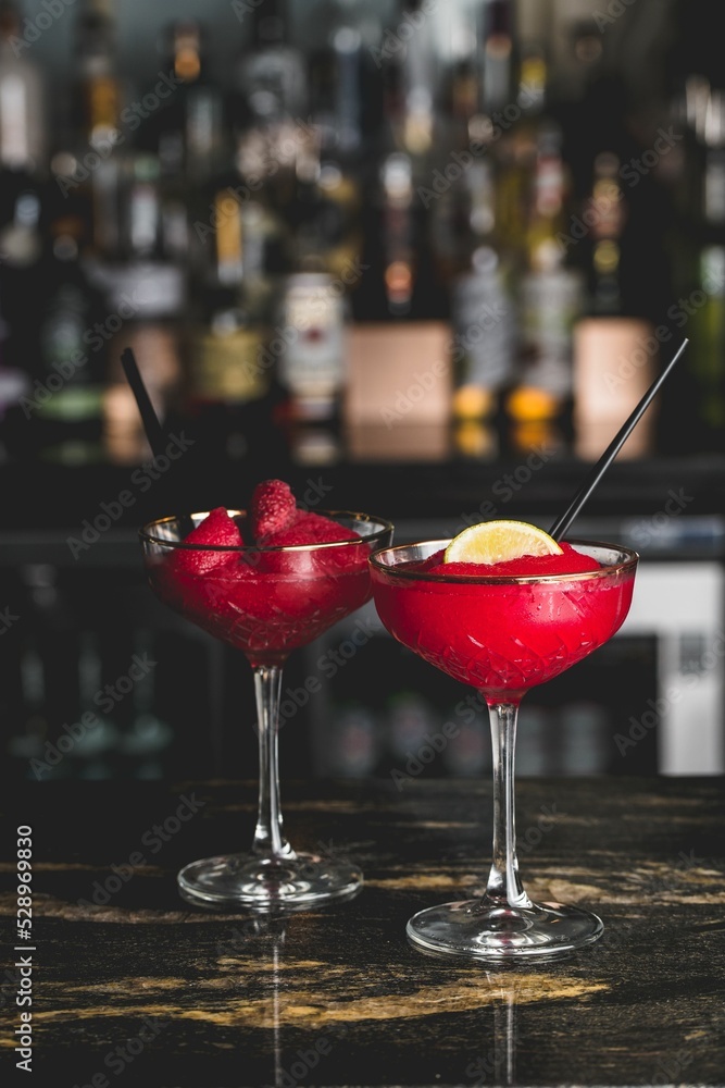 Sticker Strawberry daiquiris with berries and lemon at the bar