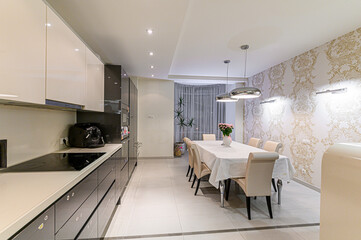 Russia, Moscow- May 21, 2020: interior apartment kitchen and dining room, refectory area cooking equipment, table furniture stove
