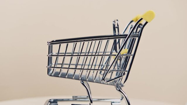 close up video of rotating empty shopping trolley.