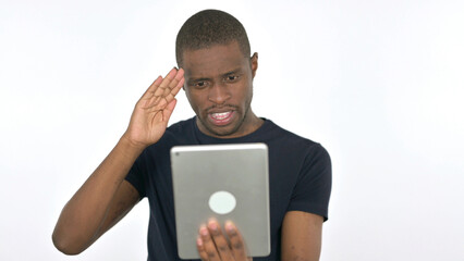 Video Call on Tablet by Young African Man on White Background