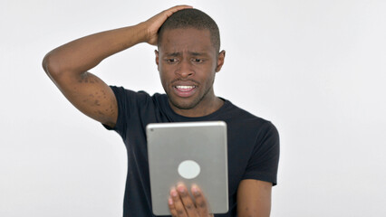 Young African Man Reacting to Loss on Tablet on White Background