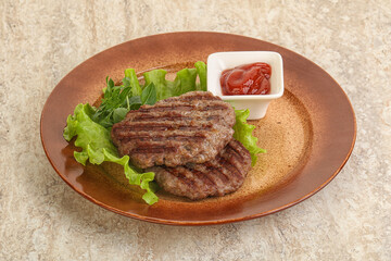 Grilled beef burger cutlet with sauce