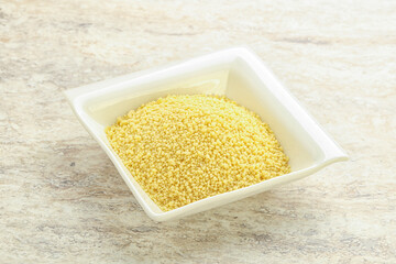 Raw couscous in the bowl