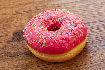 Sweet glazed struwberry donut with icing