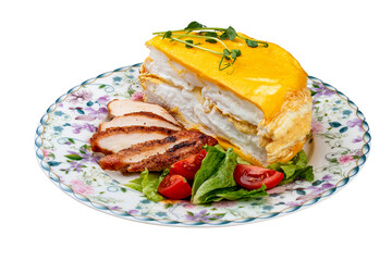 Scrambled eggs layered with fried chicken breast and fresh vegetables. Breakfast.