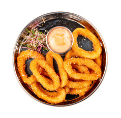 Onion rings fried in breading with cheese sauce