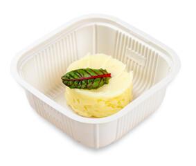 Mashed potatoes.  In a plastic container. Food to go. On a light background.