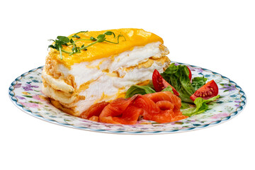 Scrambled eggs layered with salmon and fresh vegetables. Breakfast.