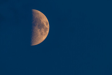 Moon in the night sky with visible craters.