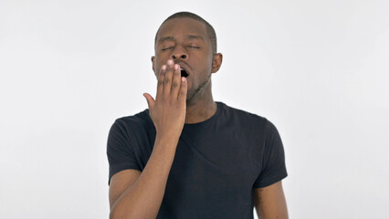 Yawning Young African Man on White Background