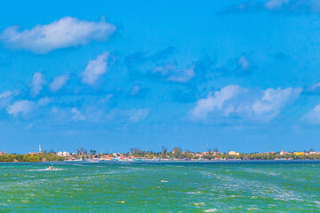 Panorama landscape view Holbox island turquoise water and ferry Mexico.