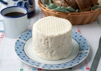 Artisanal fresh white cheese from Minas Gerais, Brazil with coffee and bread