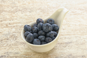 Sweet ripe blueberry heap in the bowl