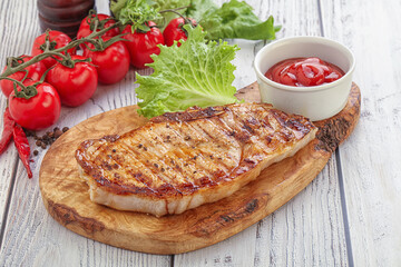 Grilled pork steak with ketchup