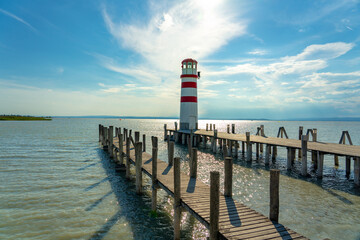 light house on pier in Podersdorf Austria next to Neusiedlersee on a sunny day