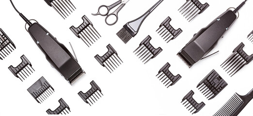 Professional hair clippers with set of nozzles of different sizes isolated on white background, banner. Top view. Copy space for text