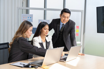 A group of young Asian businessmen Talking and planning work happily and have fun. at the company's office