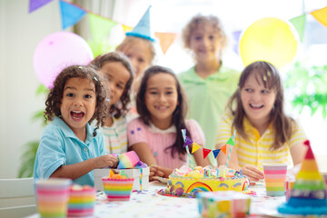 Fototapeta premium Kids birthday party. Children with cake and gifts