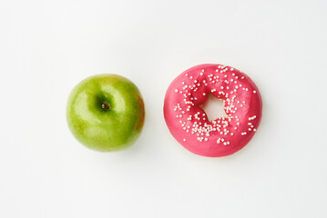 Green apple and red donut background