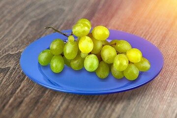 Tasty sweet aroma ripe grapes on a plate