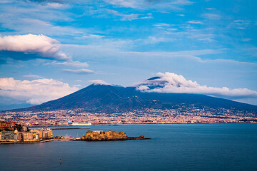 Mt. Vesuvius, Naples, Italy over Naples Bay at twilight.