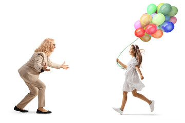Full length profile shot of a girl with balloons running towards her mother