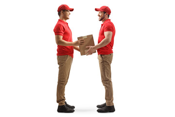 Full length profile shot of a worker handing a cardboard box to a delivery man