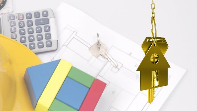 Animation of keys with house over desk with building plans and tools