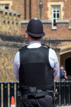 London bobby. English policeman from behind in a street of London UK