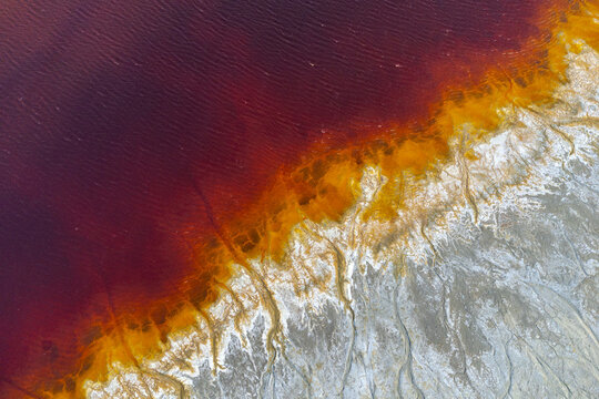 Colorful textures on sandy terrain at mine site in Huelva