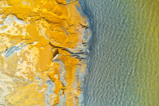 Colorful textures on sandy terrain at mine site in Huelva