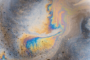 Color Gasoline fuel spots on Asphalt Road as Texture or Background