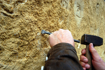 a stonemason working with stone