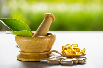 Alternative medicine herbal organic capsule with vitamin E omega 3 fish oil, mineral, drug with herbs leaf natural supplements for healthy good life.