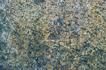 Raw gray granite rock texture background. Fragment of natural stone wall